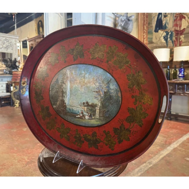 Bring rich color and decorative charm to a coffee table, ottoman, or bar with this elegant antique French tôle tray,...