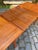 A masterful example of Danish engineering and craftsmanship: This rectangular teak dining table from Faarup Møbelfabrik...