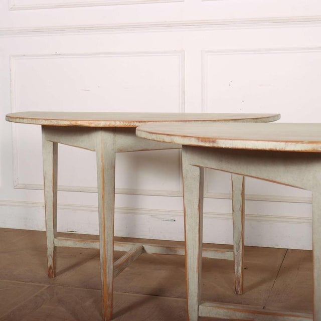 Pair of early 19th C Swedish demi-lune console tables with later paint. These can be pushed together to make a circular...