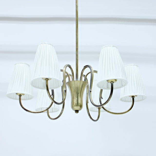 Swedish Modern, 6-light brass chandelier. very nice, almost drop shaped, central decor element from which all of the 6...