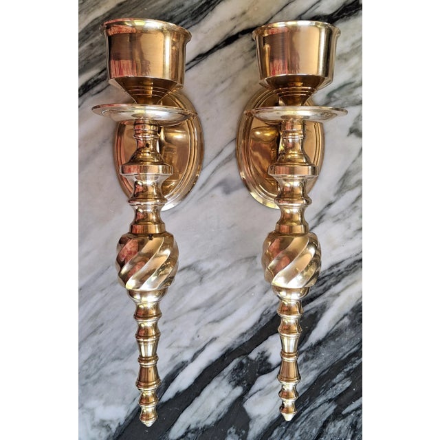 Solid brass and of the quality one expects from the era, here is a traditional style pair of candle wall sconces polished...