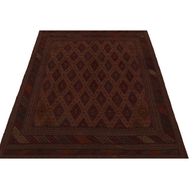 Hand-knotted in wool circa 1950-1960, this 7x9 vintage Afghani tribal rug is a new curation from Rug & Kilim. On the...