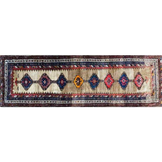 This handsome Antique Kurdish Runner is an outstanding example of early 20th-century Kurdish weaving, displaying the bold...