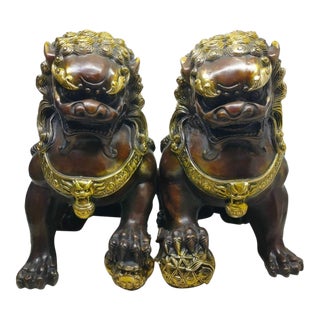 Pair of Vintage Chinese Gilt Bronze Guardian Lions (Foo Dogs) on Embroidered Balls For Sale