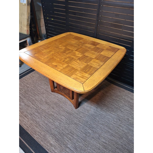 1960's table that holds a beautifully grained checkerboard parquet top in 5" squares with distinctive rounded and beveled...