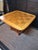 1960's table that holds a beautifully grained checkerboard parquet top in 5" squares with distinctive rounded and beveled...