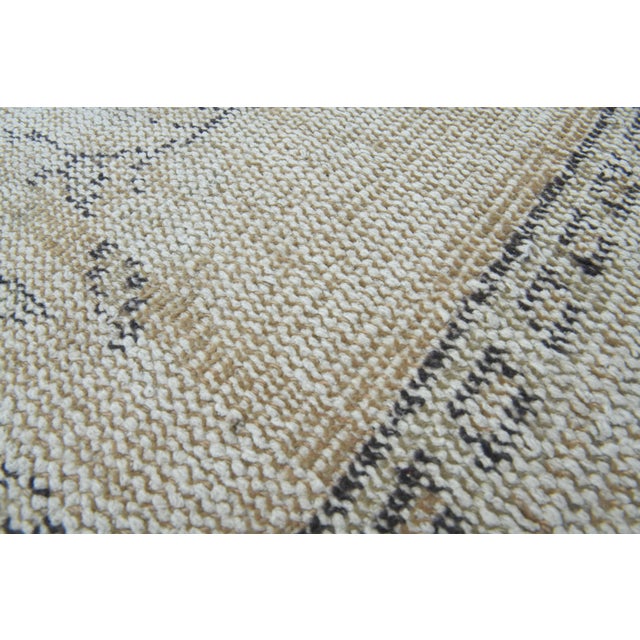 Vintage Hand-Knotted runner rug is a semi-antique vintage area rug. The '70s Eastern region of Anatolia's unique rug is...