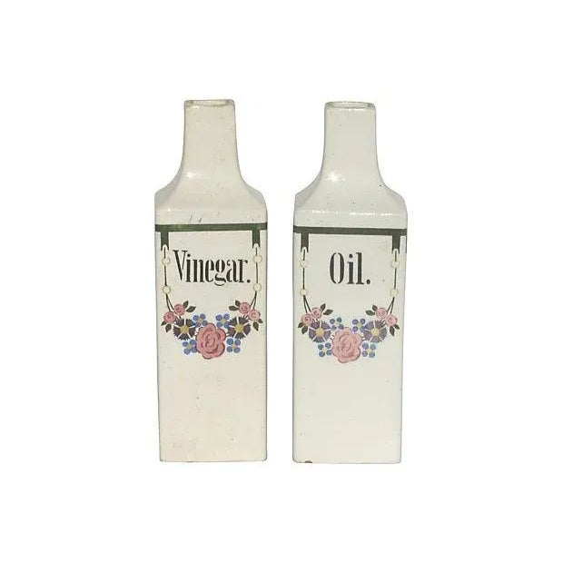 Five-piece European faience canister set created for the English speaking market. Set consists of oil and vinegar cruets...