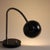 This black desk or table lamp was designed by Bauhaus master Christian Dell and manufactured by Kaiser Idell. It consists...