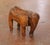 Rest your feet on this charming vintage elephant stool. Crafted in Spain circa 1970, the freestanding sculptural stool is...