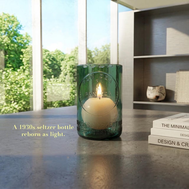 This unique candle luminaire is created from an original 1930s Argentine seltzer bottle, carefully cut and repurposed to...