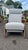 Stylish and comfortable Mid-Century Modern style reclining armchair featuring smooth sculptured wooden arms and clean...