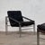 This striking pair of mid-century armchairs embodies the functional elegance of the Bauhaus movement, featuring a...