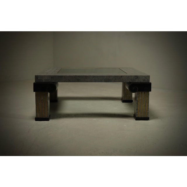 This 1980s coffee table by Maitland-Smith features an eye catching geometric form which is characteristic for the...