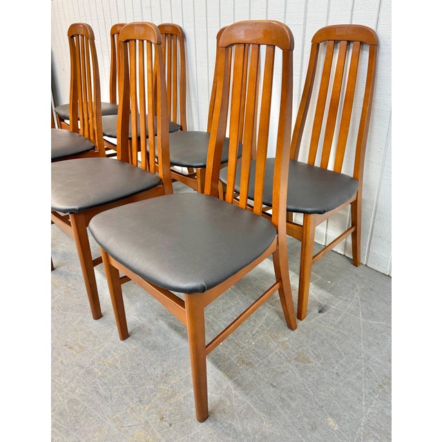 This listing is for a set of eight Vintage Danish Modern Eva Style Teak Dining Chairs. Featuring a Koefoed Eva style...