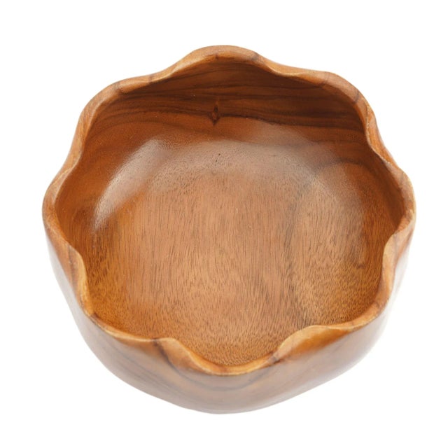 Hand turned & carved eight lobe bowl of native Hawaiian monkeypod wood. The bowl features a carved rim of eight tapered...