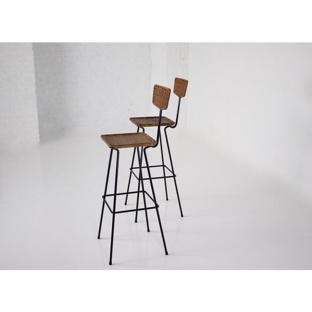 Professor herta-maria witzemann (1918-1999) for erwin behr publisher, pair of rattan hatch stools, with black lacquered...