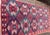 An attractive antique Yomud Turkoman rug fragment featuring an all-over lattice of large hooked diamond medallions set...