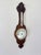 Quality antique Edwardian carved oak aneroid barometer, having a quality antique Edwardian aneroid banjo barometer with a...