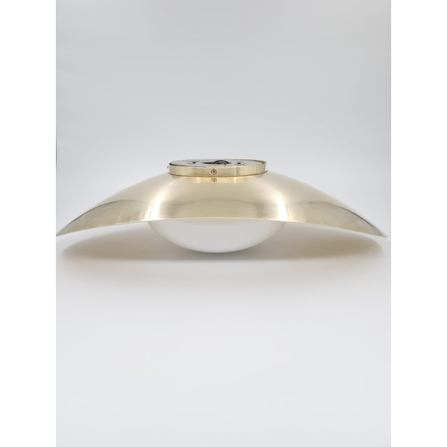 A sculptural flush mount designed by Kelly Wearstler for Visual Comfort, the Nouvel ceiling fixture pairs refined...