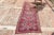 Vintage Herki Hand-Knotted Hallway Runner Rug is a semi-Vintage rug. '50s Eastern region of Turkey's unique rug is...