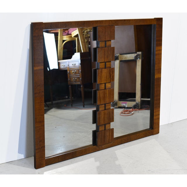 This Mid-Century Lane Brutalist Mirror features a bold wood frame and 2 mirrors with a unique wood pattern between the...
