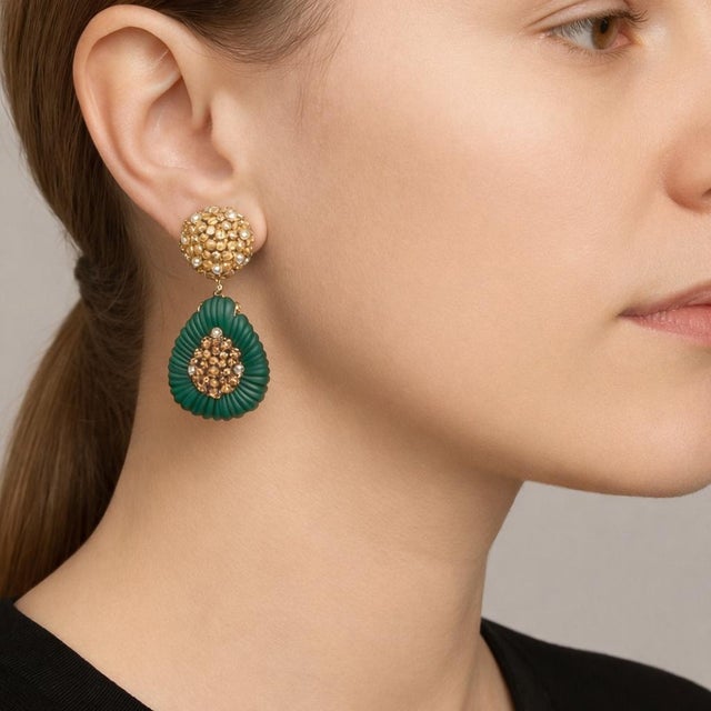 An exceptional pair of vintage Italian statement earrings, masterfully crafted in solid 18 karat gold and adorned with...