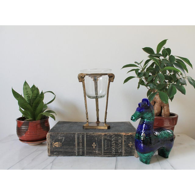 Vintage solid brass tea light holder stand with rams head and foot motif. No makers mark. Minor age wear.