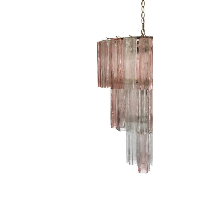 A vintage hand blown Venini Murano "Tronchi" tiered chandelier from the mid-20th century. This exquisite Venini "Tronchi"...