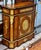 Bring sophisticated European elegance to your interior with this grand French Louis XVI-inspired cabinet, featuring a rich...