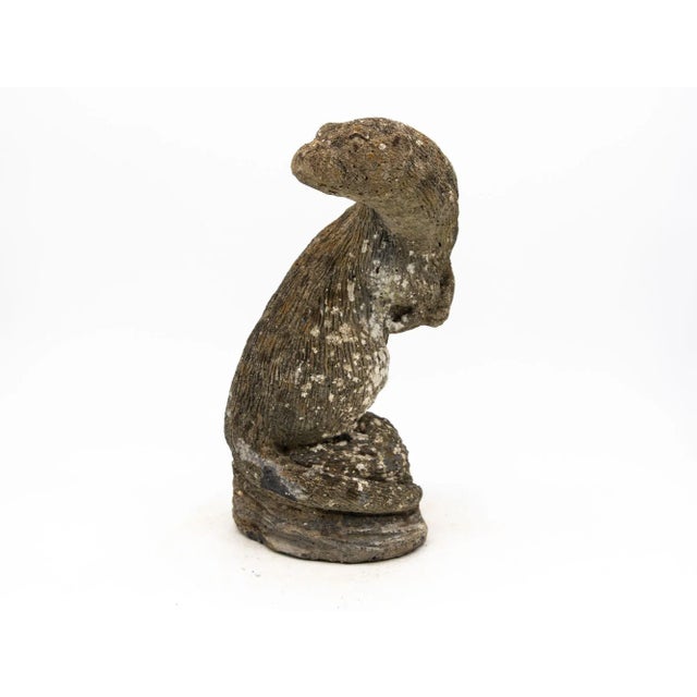 This Mid-20th century French garden ornament, crafted from reconstituted stone, depicts a lifelike otter. The intricate...