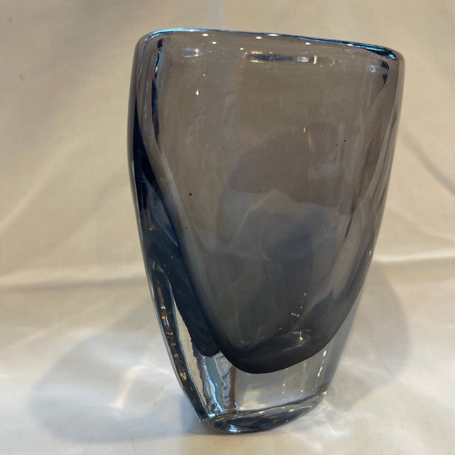This a beautiful design of Nils Landberg's "Sommerso" vase featuring an inner layer of colored smoky gray glass cased in...