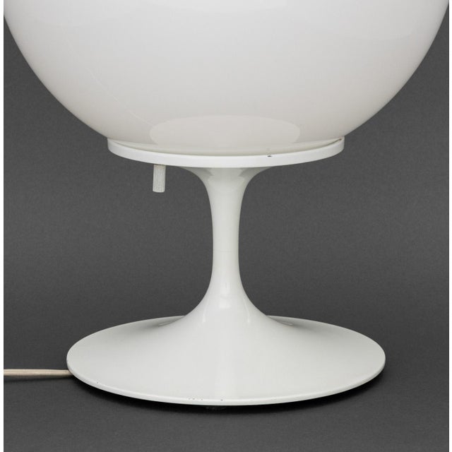 Bill Curry for Design Line "Stemlite" Table Lamp, 1960s, with white glass globe shade atop a tulip base, paper label to...