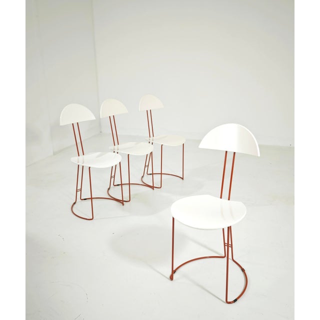 Set of 4 chairs with a modernist and minimalist aesthetic. A true icon of 1980s Italian postmodern design, it plays on the...