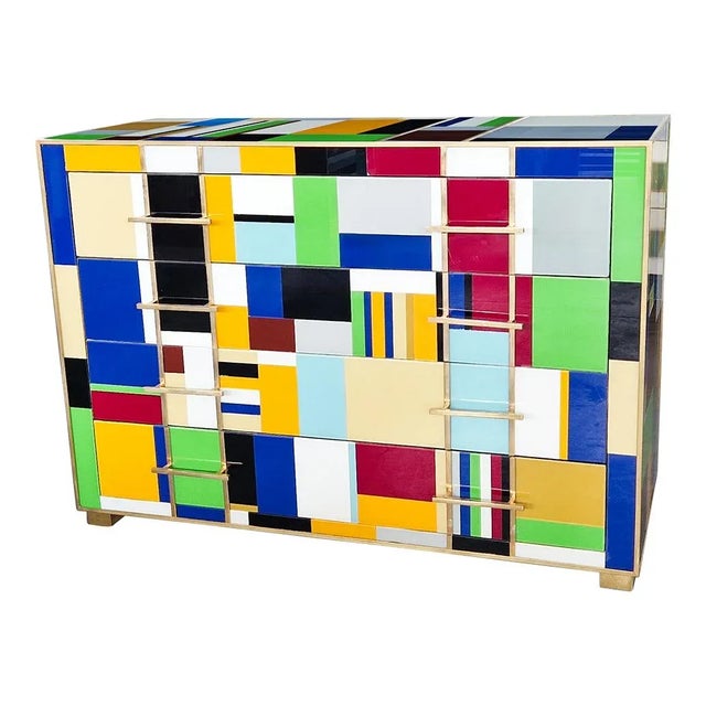 Dresser with four drawers, entirely handmade, with wooden structure covered in "Mondrian" style multicolored glass tiles;...