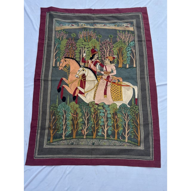 This vintage Indian textile wall hanging, estimated to be 25–30 years old, is handcrafted on organic cotton using fine...