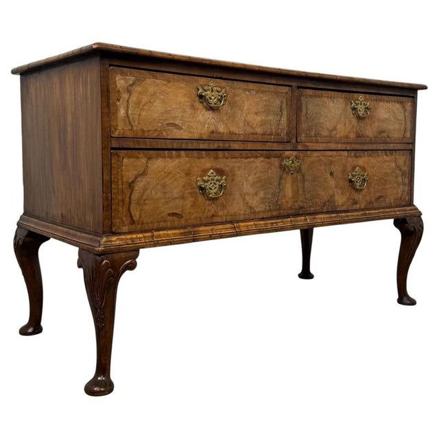 An exceptional early 18th-century English Queen Anne chest of drawers, beautifully crafted in walnut and distinguished by...