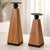 Add organic charm and modern structure to your home with this set of pillar candle holders, blending natural wood grain...