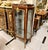Showcase your most treasured collectibles in this magnificent French Louis XV Curio Display Cabinet, a luxurious statement...