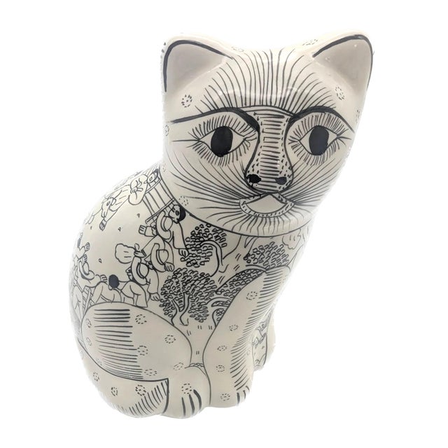 Offered is a black and white glazed red clay terracotta decorative cat figurine depicting a village gathering - possibly a...