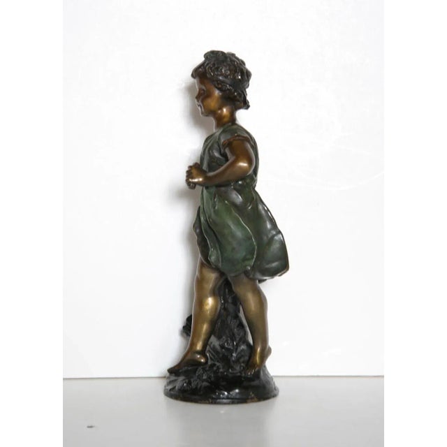 Petit Fille Auguste Moreau Medium: Bronze Sculpture Year: Not specified Size: 14.5 x 5 x 4.5 in. (36.83 x 12.7 x 11.43 cm)