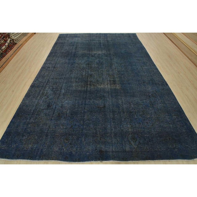 An authentic vintage traditional Overdyed Tabriz rug hand-knotted with an all-wool pile on a cotton foundation. This...