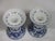 A pair of blue and white porcelain candle holders decorated with all over designs of flowers and leaves. They were made...