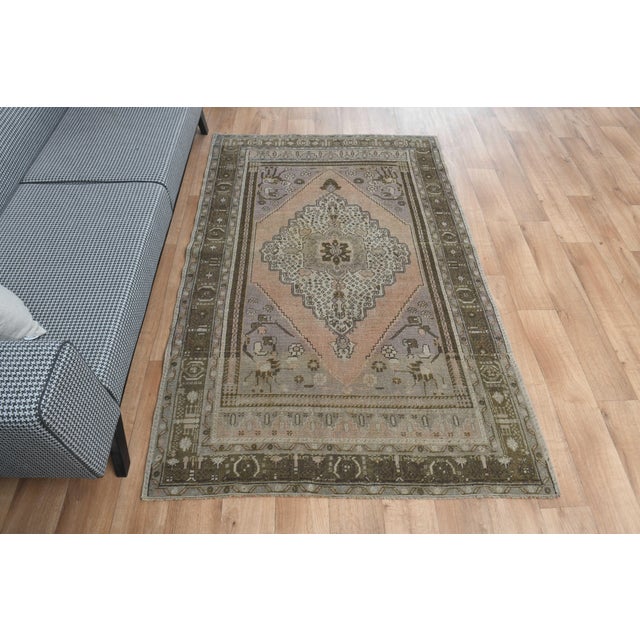 Vintage Hand-Knotted runner rug is a semi-antique vintage area rug. The '70s Eastern region of Anatolia's unique rug is...