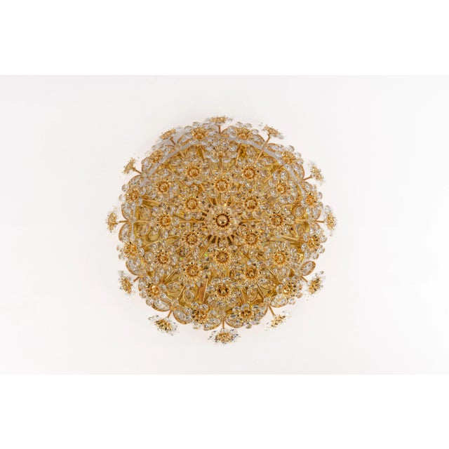 Petite delicate floral flush mount with crystal glass and gilded brass parts made by palwa, germany, 1970s. Featuring a...