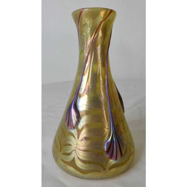 This is an outstanding Loetz Phaenomen Genres vase made in Austria. The glass is opal ground and combed with silver-yellow...