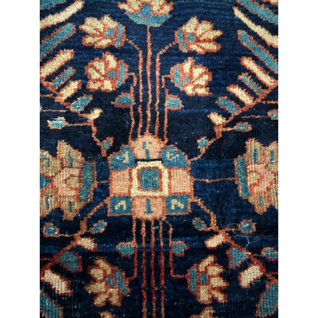 Early 20th-century hand-knotted Persian Sarouk Mohajeran rug with a dark navy field featuring a stylized Tree of Life...