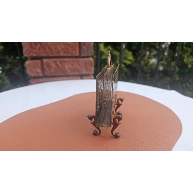 Art Nouveau brass napkin stand, letters, griffin base, dimensions: height 14.7 cm, width 12.3 cm, depth 6.2 cm.