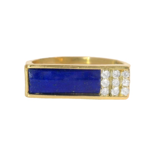 Make a bold statement with this 14K Yellow Gold Diamond and Lapis Lazuli Men's Ring. This striking piece features a rich,...