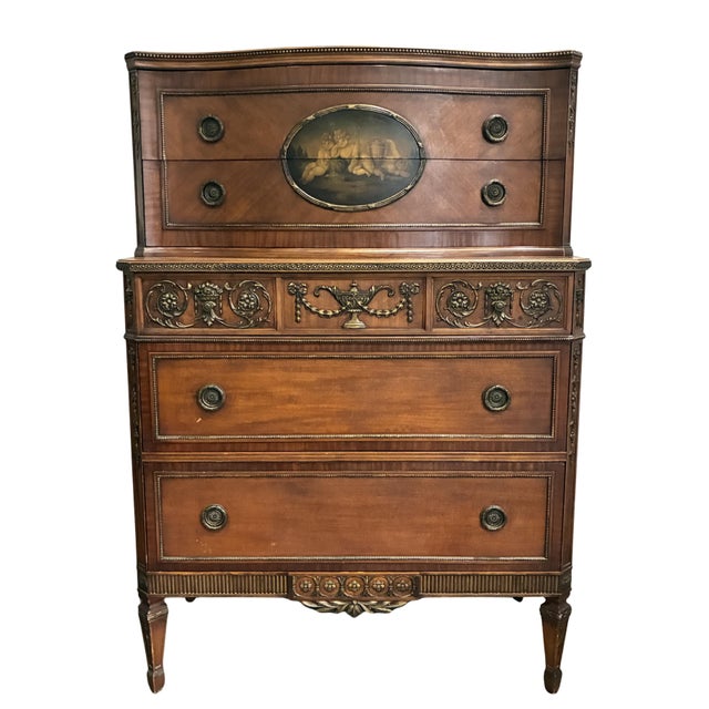 An exceptional early 20th-century Neoclassical chest-on-chest showcasing richly figured mahogany veneers, finely cast...